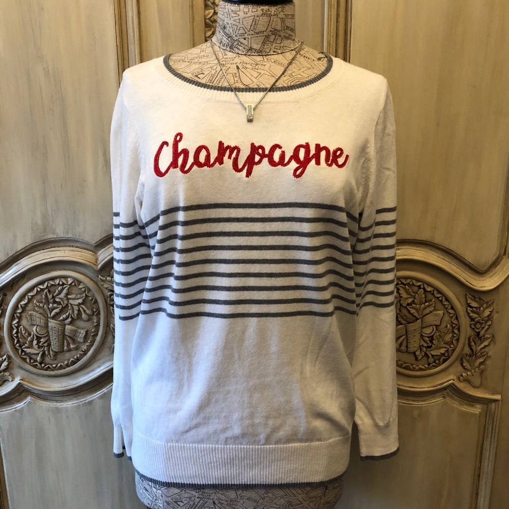 Chaser Sweater that says “Champagne”